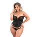 Curvy woman wearing black mesh corset with front zipper and matching G-string posing against white background.