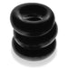 Three stacked black jumbo flexible cock rings made of soft Flextpr material with a smooth matte finish.