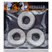 Three white jumbo cockrings in clear packaging with Oxballs branding and orange accents