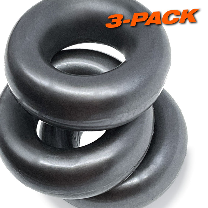 Three large black flexible cock rings stacked with 3-pack label in orange text on white background.