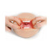 Hands stretching open a realistic oral stroker toy showing detailed lips, teeth, tongue, and textured interior tunnel.