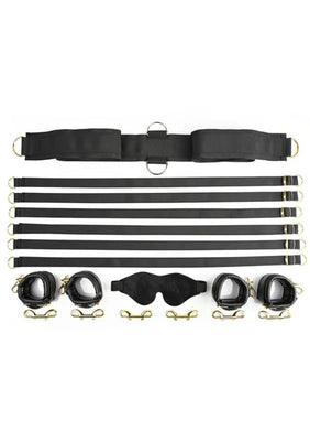 Special Edition Under the Bed Restraint Set with black adjustable straps, faux leather cuffs, golden hardware, and a soft blindfold.