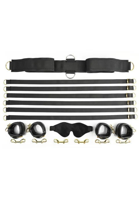Special Edition Under the Bed Restraint Set with black adjustable straps, faux leather cuffs, golden hardware, and a soft blindfold.
