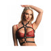 Blonde woman wearing a black adjustable faux leather chest harness over a red lace bra, posing with one arm raised.