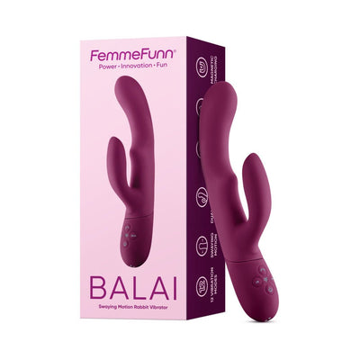 Femme Funn Balai rabbit vibrator in deep purple with dual stimulating heads and ergonomic design next to its pink and purple packaging.