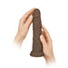Hands holding a brown wireless Turbo Shaft vibrator with realistic texture and suction base.