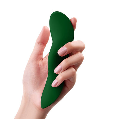 Hand holding a sleek, dark green ergonomic panty vibrator with a smooth, curved design.