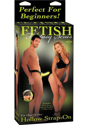 Packaging of Fetish Fantasy Hollow Strap-On featuring a man and woman modeling the product, highlighting its beginner-friendly design.