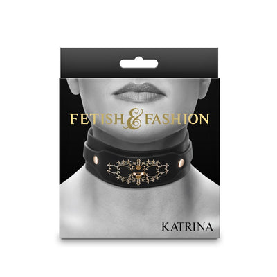 Packaging of Fetish & Fashion Katrina Collar in black with gold decorative details shown on a model's neck.