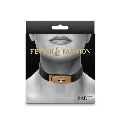 Packaging of Fetish & Fashion Sadie Collar in black with gold-tone buckle shown on a model's neck against a black background.