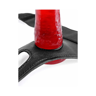 Close-up of black crotchless strap-on harness with red textured insert demonstrating secure fit through center opening.