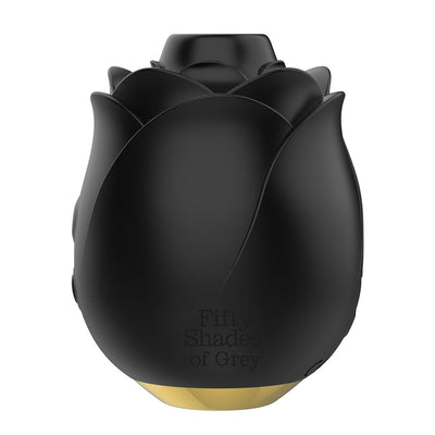 Black rose-shaped clitoral suction stimulator with gold base and Fifty Shades of Grey branding.