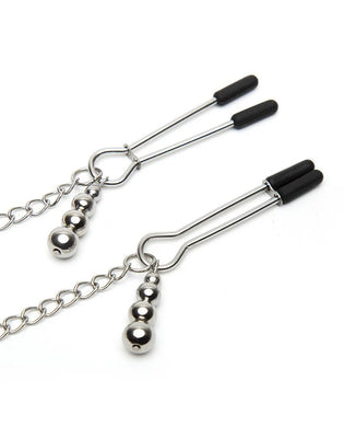 Adjustable silver nipple clamps with silicone tips and decorative bead chains on a white background.