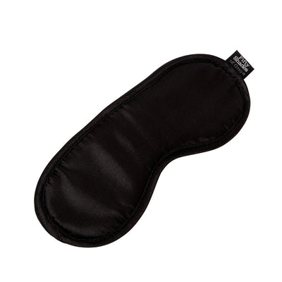 Black satin blindfold with Fifty Shades of Grey label for sensory play and enhanced intimacy.