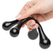 Hand holding a black ergonomic body massager with four smooth rounded massage points.