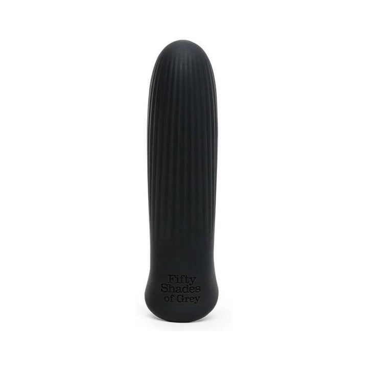 Black ribbed bullet vibrator with rounded tip and Fifty Shades of Grey logo on base, sleek silicone finish.