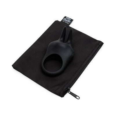 Black silicone rabbit ear vibrating love ring resting on a black zippered storage pouch with Fifty Shades of Grey branding.