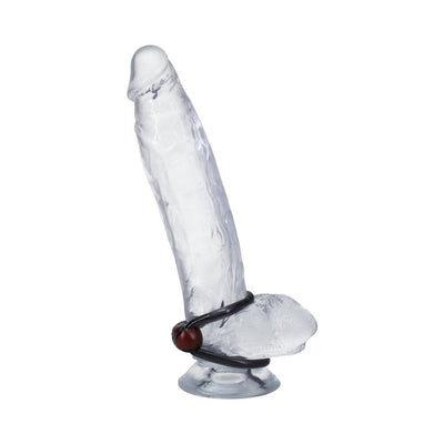 Clear silicone penis model displaying Firmtech Performing C-ring with asymmetrical latch and loop design.