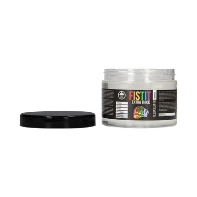 Open jar of Fist It Extra Thick water-based lubricant with black lid beside it, featuring rainbow label design.
