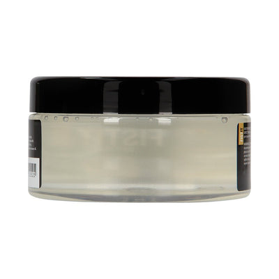 Clear jar of Fist It water-based lubricant with a black screw-on lid, shown from the side.