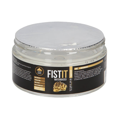 Clear jar of Fist It water-based lubricant with black and gold label, sealed with a silver foil lid.