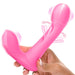 Hand holding a pink G-spot vibrator with flicking and vibrating motion indicators.