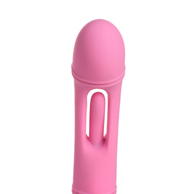 Close-up of pink silicone G-spot vibrator with flicking arm detail on a white background.
