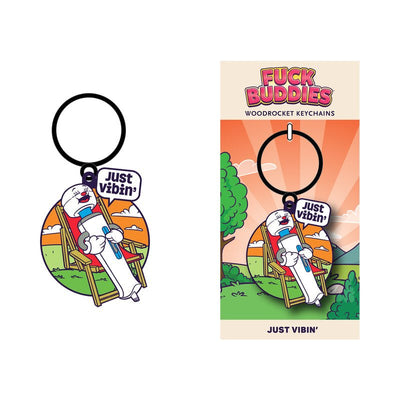 Enamel keychain featuring a relaxed wand vibrator character lounging in a chair with a "Just Vibin'" speech bubble.