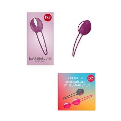Fun Factory Smartball Uno kegel ball in white and grape with packaging and instructional guide.