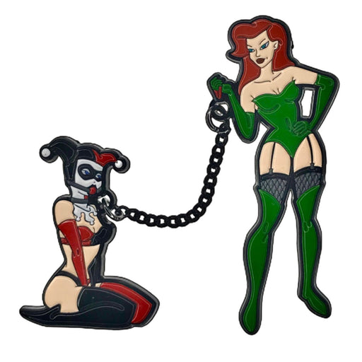Double enamel pin set featuring a red-haired woman in green and a kneeling figure in red and black connected by a black chain.