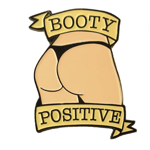 Vanilla light enamel pin featuring a stylized booty in black underwear with "Booty Positive" banner design.