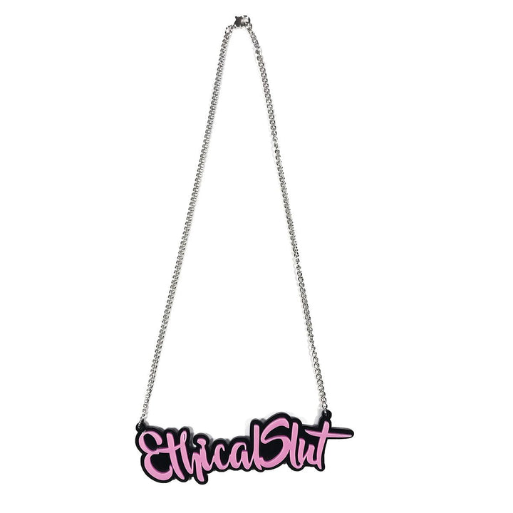 Silver chain necklace with pink acrylic pendant spelling out Ethical Slut in stylized script font