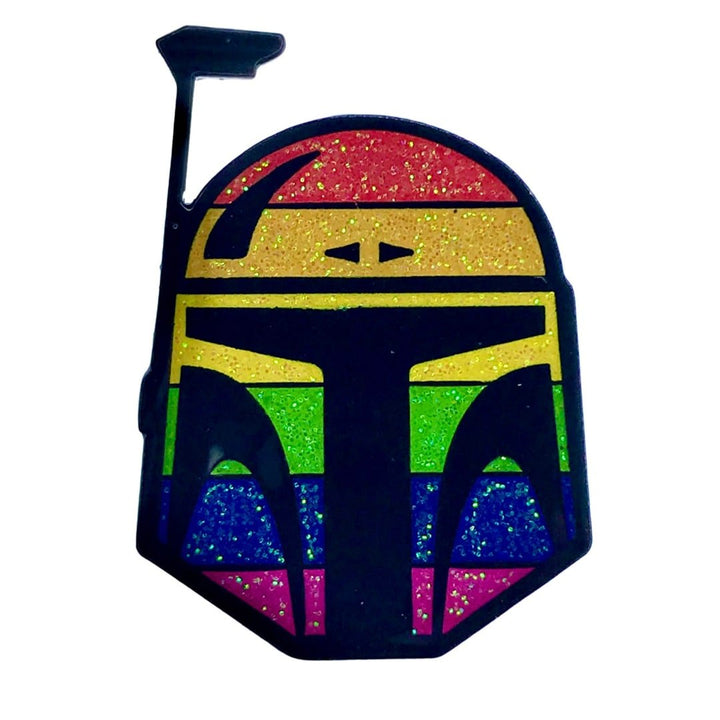 Enamel pin of a helmet with rainbow pride colors and glitter accents, inspired by a popular sci-fi bounty hunter.