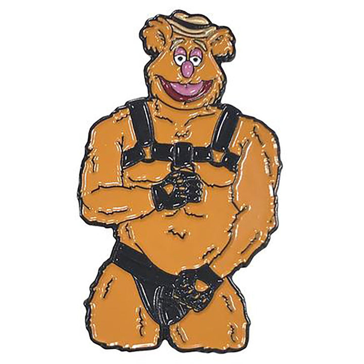 Enamel pin of a muscular bear character wearing black leather harness and gloves, playful and bold accessory design.