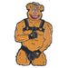 Enamel pin of a muscular bear character wearing black leather harness and gloves, playful and bold accessory design.