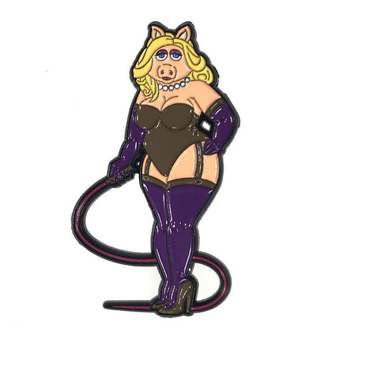 Enamel pin of a blonde pig character in black corset, purple gloves, thigh-high boots, and holding a whip accessory.
