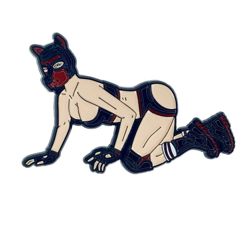 Enamel pin of a person in pup play gear crawling, featuring black and red mask, gloves, boots, and minimal clothing.