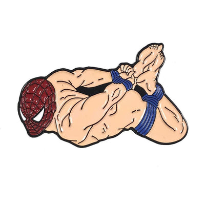 Enamel pin of a muscular figure wearing a red webbed mask, bound with blue ropes on wrists and ankles.