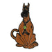 Enamel pin featuring a stylized brown dog wearing a black harness and collar with a green tag.