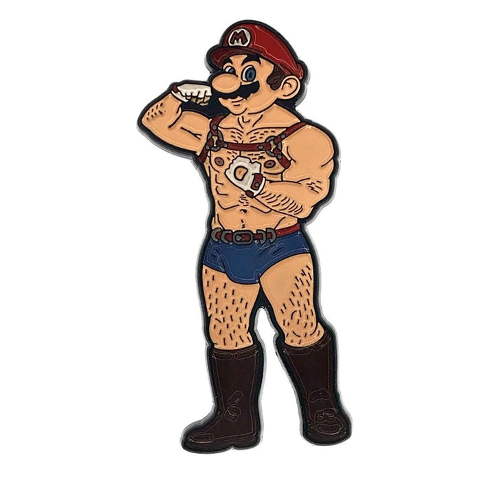 Enamel pin of a muscular cartoon character wearing a red cap, harness, blue shorts, gloves, and black boots, flexing his arm.