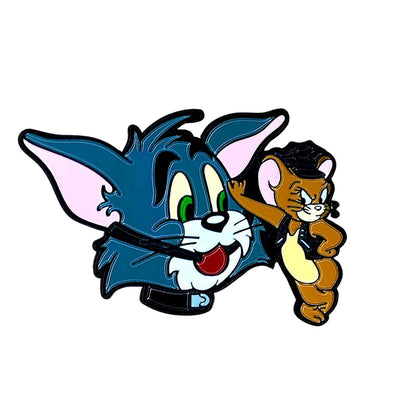 Soft enamel pin featuring Tom with a collar and Jerry dressed in a leather outfit, showcasing a playful, edgy design.