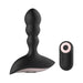 Black silicone anal vibrator with contoured shape and matching remote control with pink power button ring.
