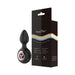 Black silicone anal plug with rose gold ring detail next to Gender Fluid branded packaging with rainbow design.