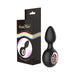 Black silicone anal plug with rose gold ring detail next to Gender Fluid branded packaging with rainbow accent.