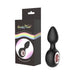 Black silicone Gender Fluid Tremor Ring Plug with rose metal accent and packaging featuring rainbow design.