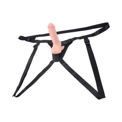 Black adjustable faux-leather strap-on harness with attached realistic silicone dildo on white background.