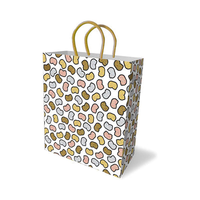 White gift bag with metallic gold, silver, rose gold, and bronze abstract shapes and gold woven handles.