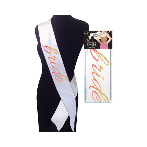 White satin bridal sash with glittery ombre "Bride" text in pink and gold displayed on a mannequin and in packaging.