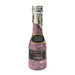 Pink glitter champagne-shaped party popper with silver foil top and label reading shoots colorful confetti.