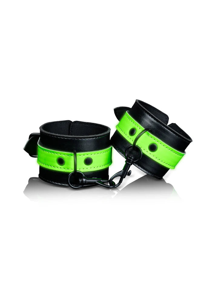 Black and neon green glow-in-the-dark handcuffs with secure metal clasps and soft padded interior.